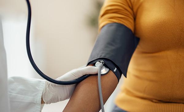 a woman getting her blood pressure taken